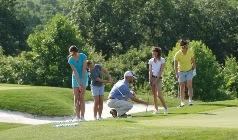 Jaime coaching a group at the practice bunker
